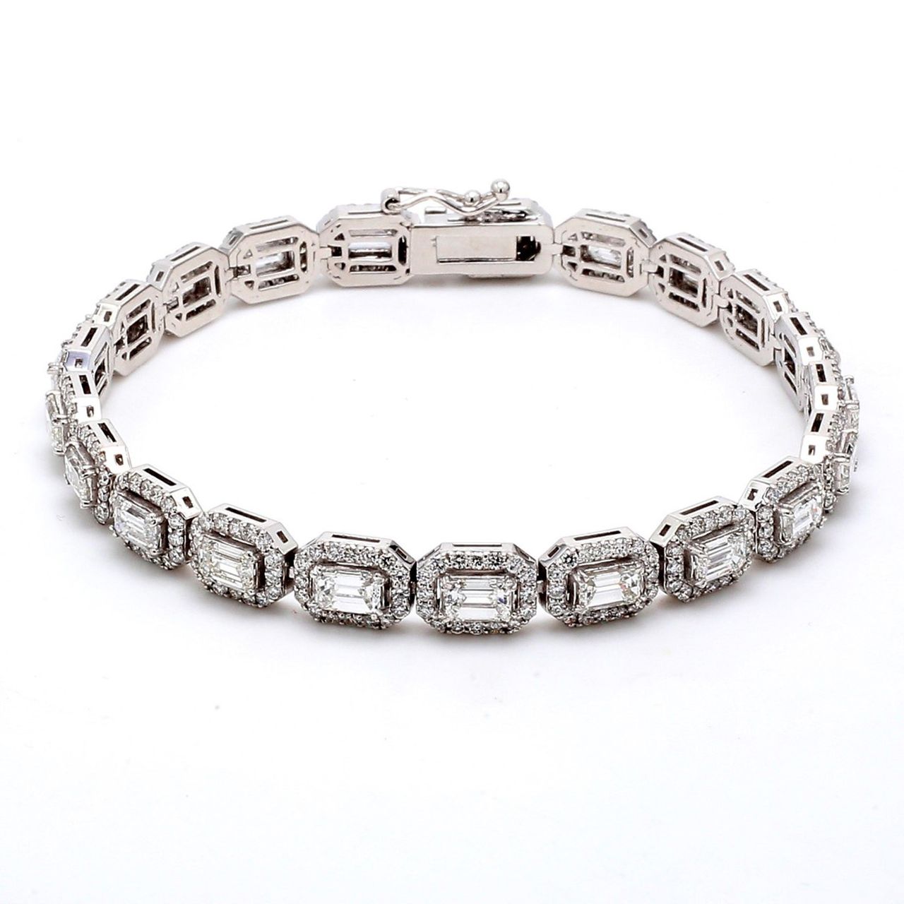 7' Halo tennis bracelet with combination shared prong set and 4-prong set round and emerald cut diamonds.  D7.99ct.t.w.