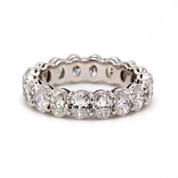 Eternity band in platinum with shared prong set E-F/VS1-VS2 oval diamonds.  D3.38ct.t.w.