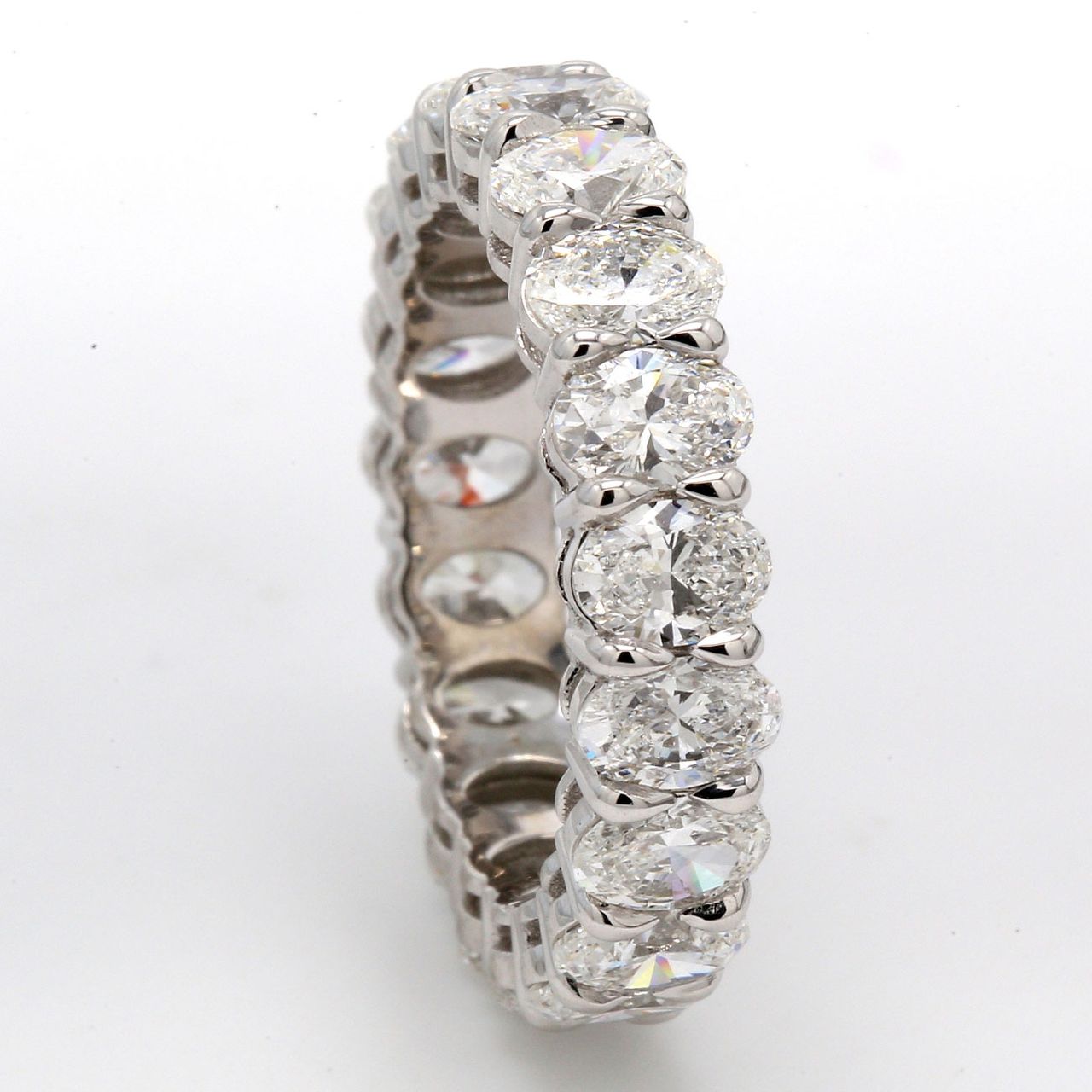 Eternity band in platinum with basket shared prong set (19) oval diamonds.  D4.70ct.t.w.  Size 6.75