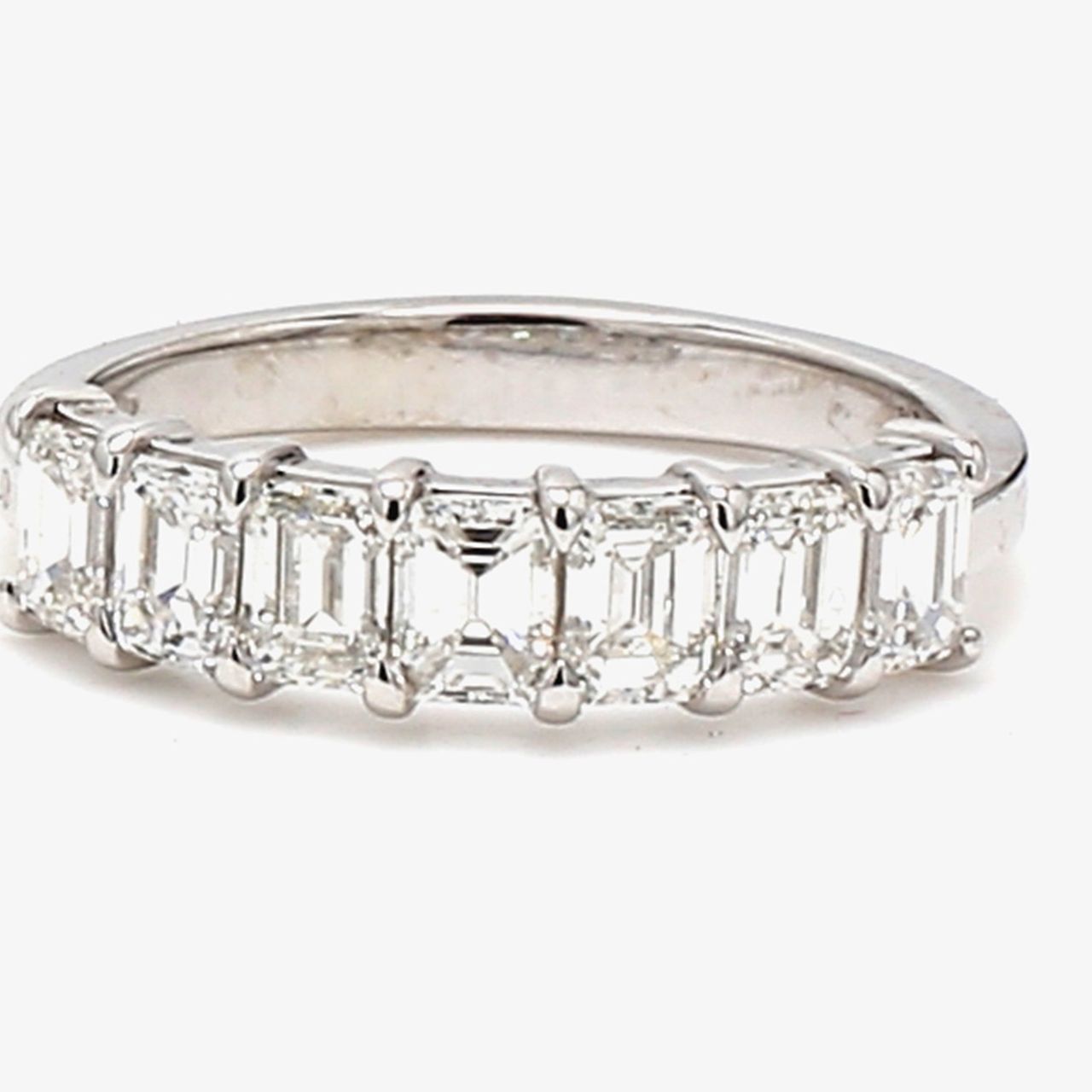 7-stone band in platinum with prong set emerald cut diamonds.  D1.32ct.t.w.  Size 5