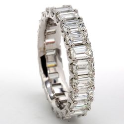 Eternity band in platinum with U-prong set (23) emerald cut diamonds.  D5.66ct.t.w.  Size 8