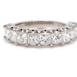 9-stone band in platinum with U-prong set princess cut diamonds.  D1.94ct.t.w.  Size 5.5