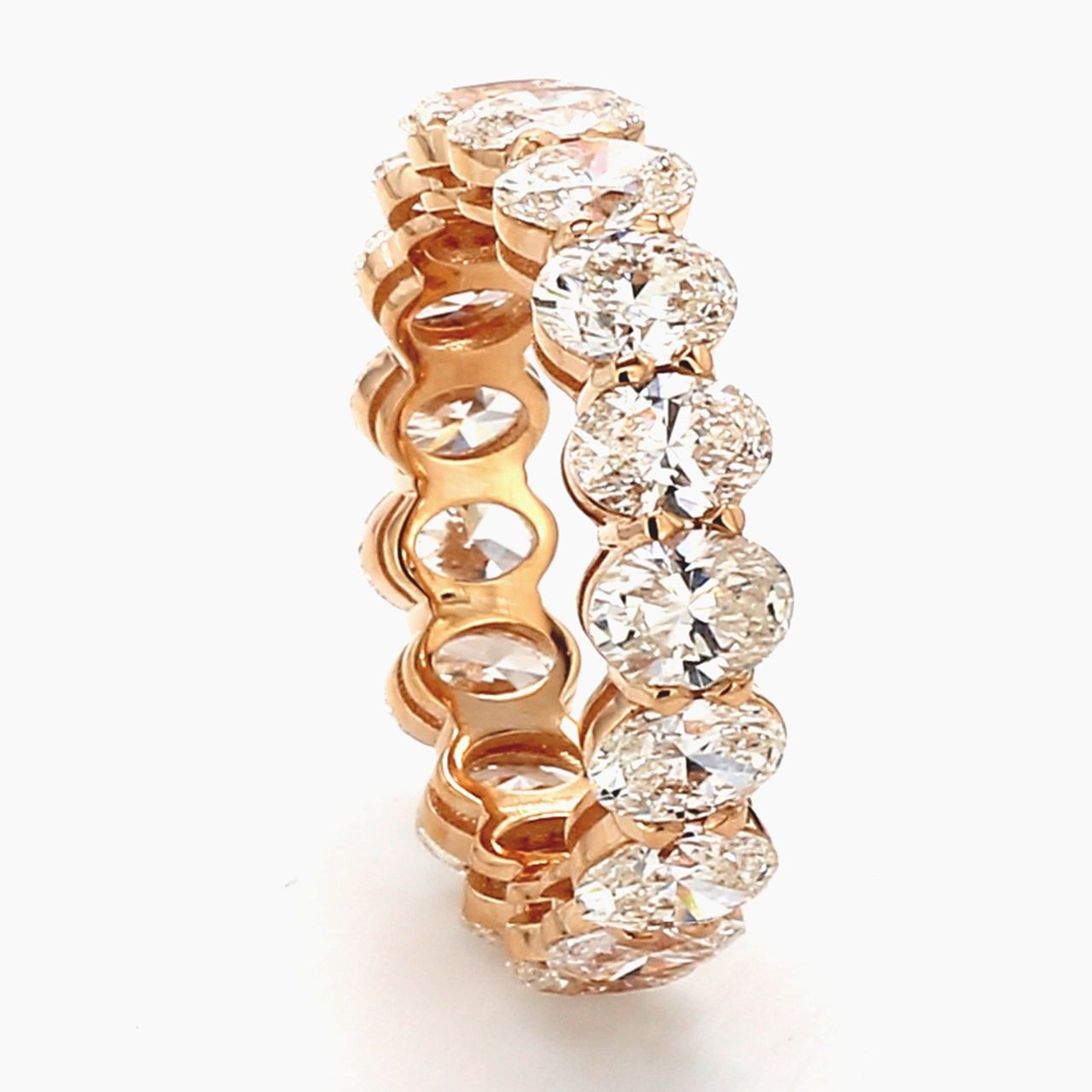 Eternity band in 18K RG with basket claw prong set (17) oval diamonds.  D6.08ct.t.w.  Size 7.75