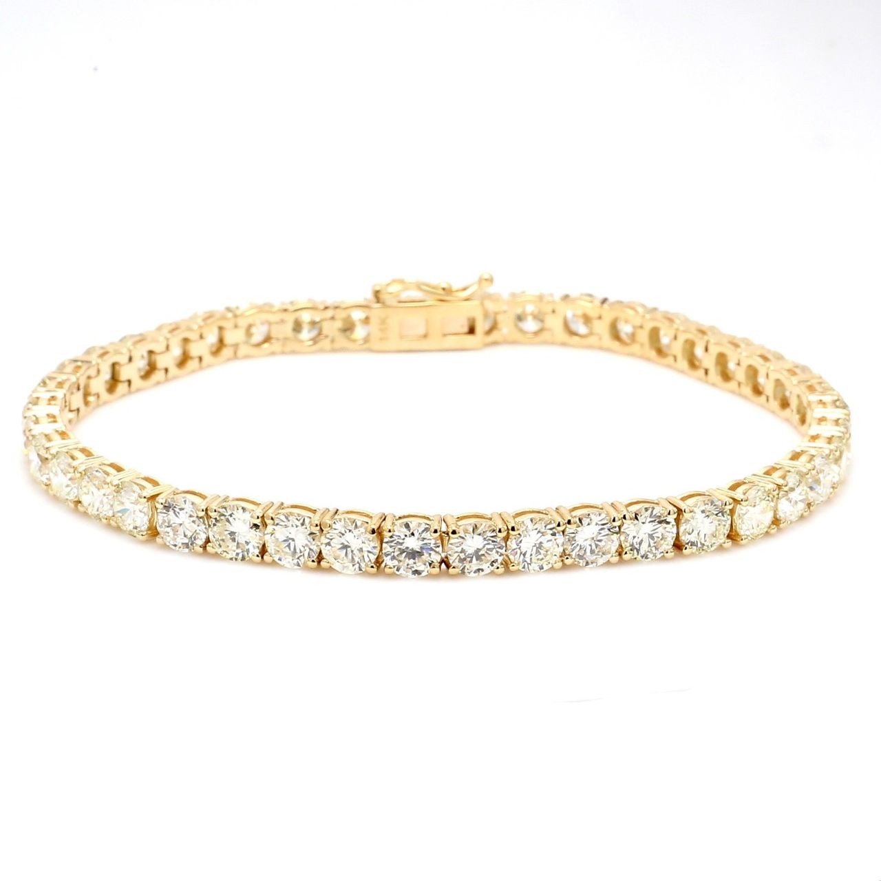 7.25' Tennis bracelet in yellow gold with 4-prong set (42) round diamonds.  D12.78ct.t.w.