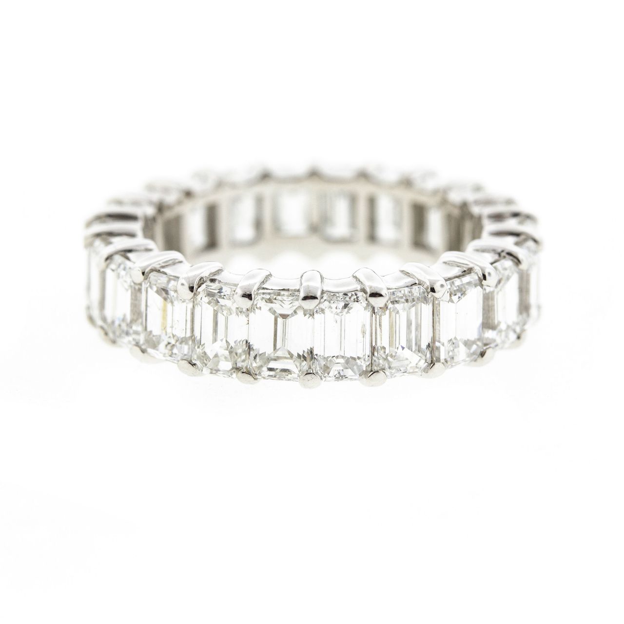 Eternity band in 18K WG with shared prong set (22) Emerald cut diamonds.  D6.65ct.t.w.  Size 6.75