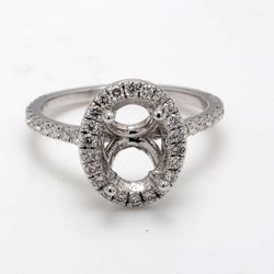 Halo semi-mount with U-prong set round diamonds.  D0.62ct.t.w.  Size 7