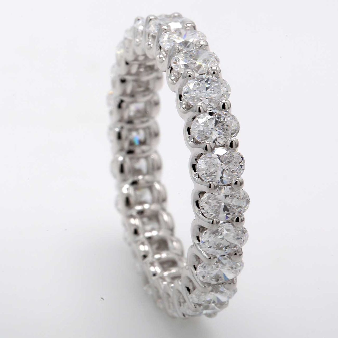 Eternity band with shared prong set (24) oval cut diamonds.  D3.20ct.t.w.  Size 7.25