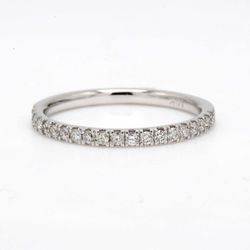Band with 4-prong set (20) round diamonds.  D0.29ct.t.w.  Size 7.25