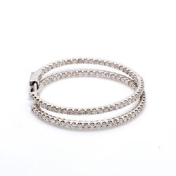 1.25' Inside out hoop earrings with U-prong set (100) round diamonds & with special spring lock.  D1.56ct.t.w.