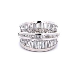 Band in 18K WG with channel set princess cut and baguette diamonds.  D4.23ct.t.w.  Size 6.75