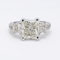 3-stone semi-mount in 18K WG with princess cut sides & pave set round diamonds.  D1.85ct.t.w.