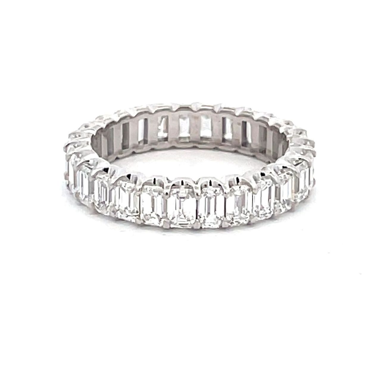 Eternity band in platinum with prong set (27) emerald cut diamonds.  D2.98ct.t.w.  Size 5.5