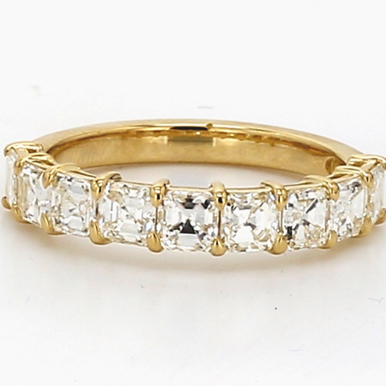 9-stone band in 18K YG with basket prong set asscher cut diamonds.  D1.48ct.t.w.  Size 5.5