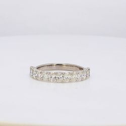 Band in white gold with half-way U-prong set oval diamonds.  D1.71ct.t.w.  Size 8.75