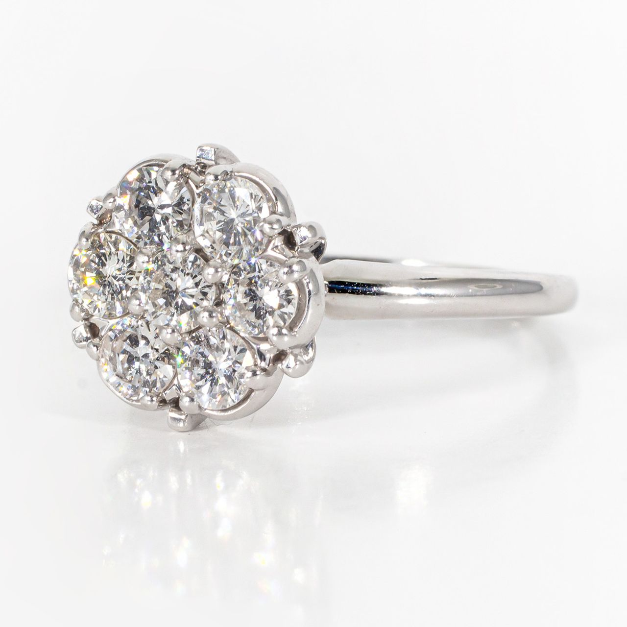 Cluster-style ring with prong-set (7) round diamonds.  D1.50ct.t.w.