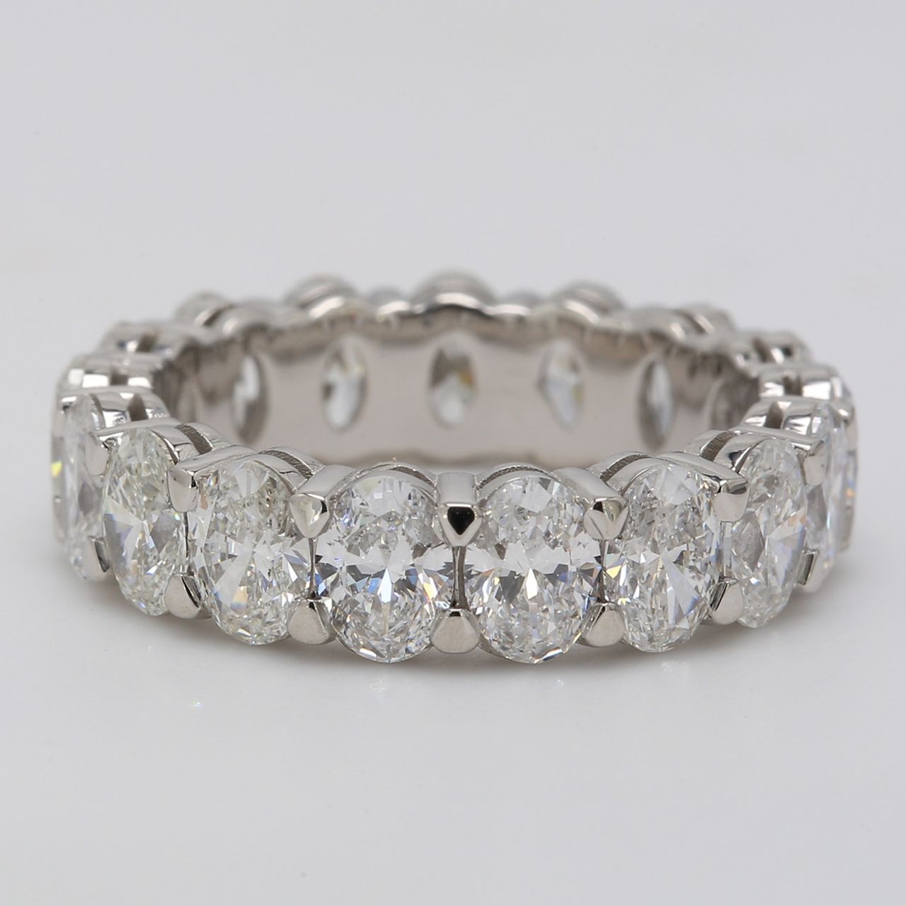 Eternity band in platinum with shared prong basket double wire set G-H/SI (15) oval cut diamonds.  D8.01ct.t.w.  Size 6