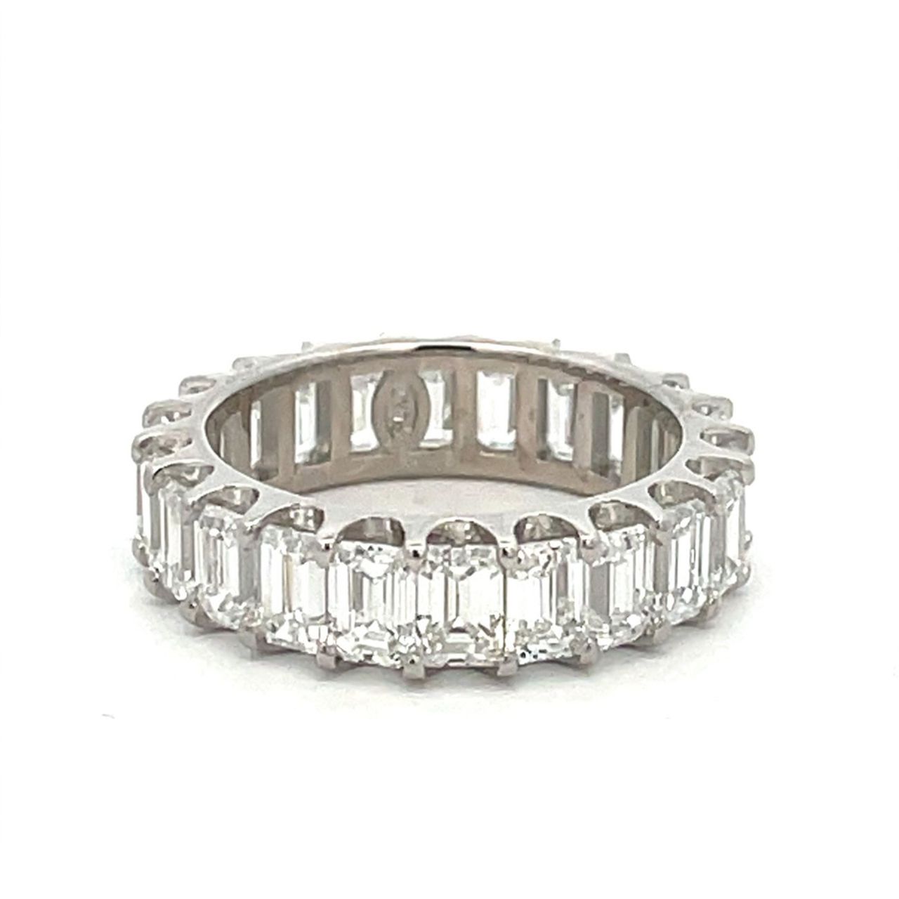 Eternity band in platinum with U-prong set (22) emerald cut diamonds.  D5.40ct.t.w.  Size 6