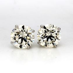 Screw back stud earrings with 4-prong basket set USA certified J-K/SI1-2 round diamonds.  D4.00ct.t.w.