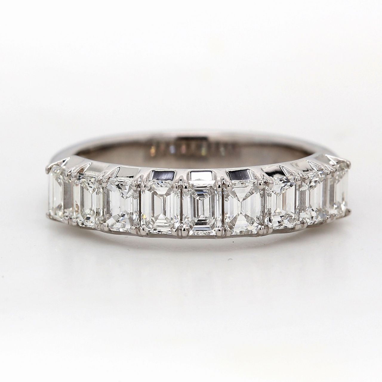 9-stone band in platinum with 4-prong set emerald cut diamonds.  D1.26ct.t.w.  Size 6