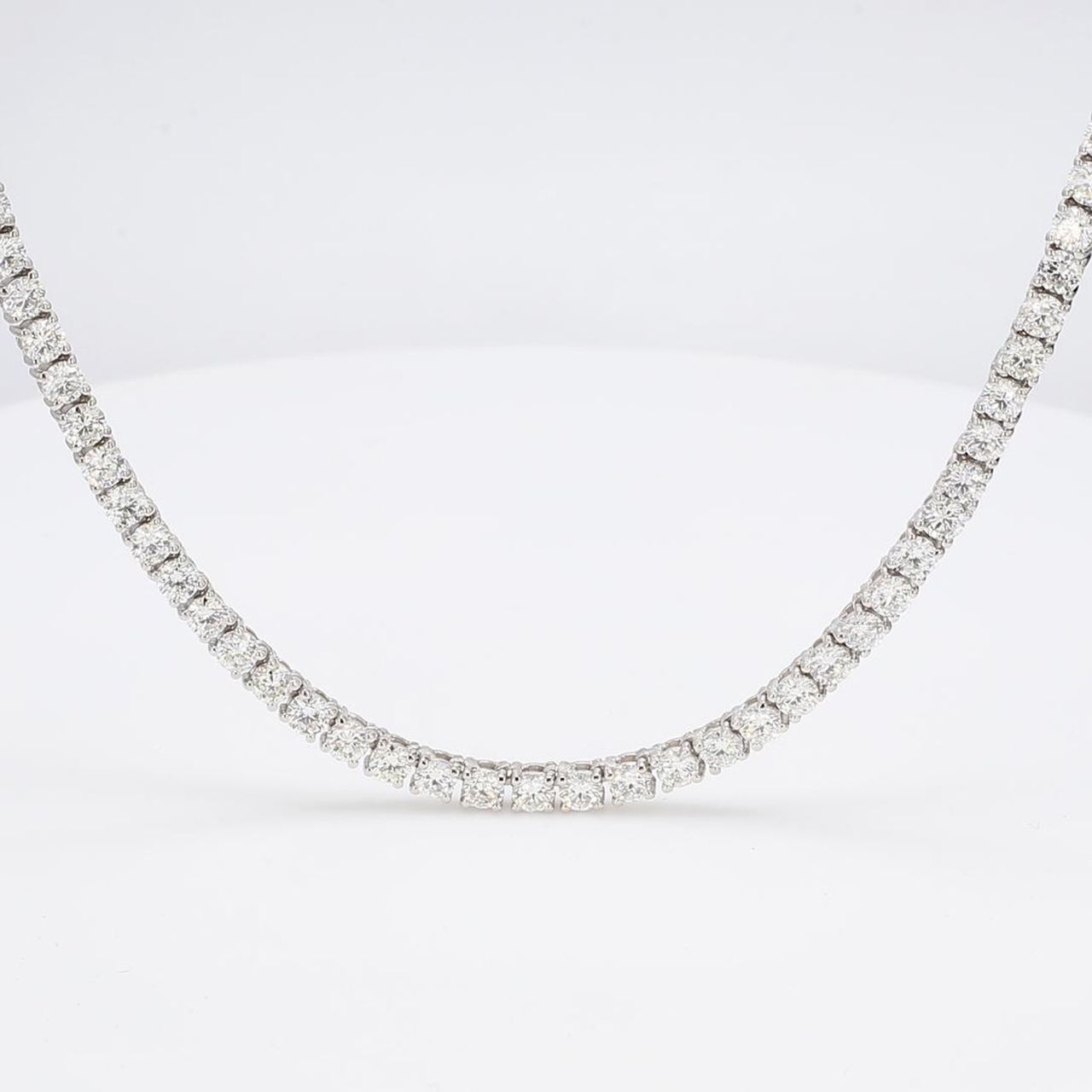 18' Tennis necklace with basket prong set (123) round diamonds.  D22.88ct.t.w.