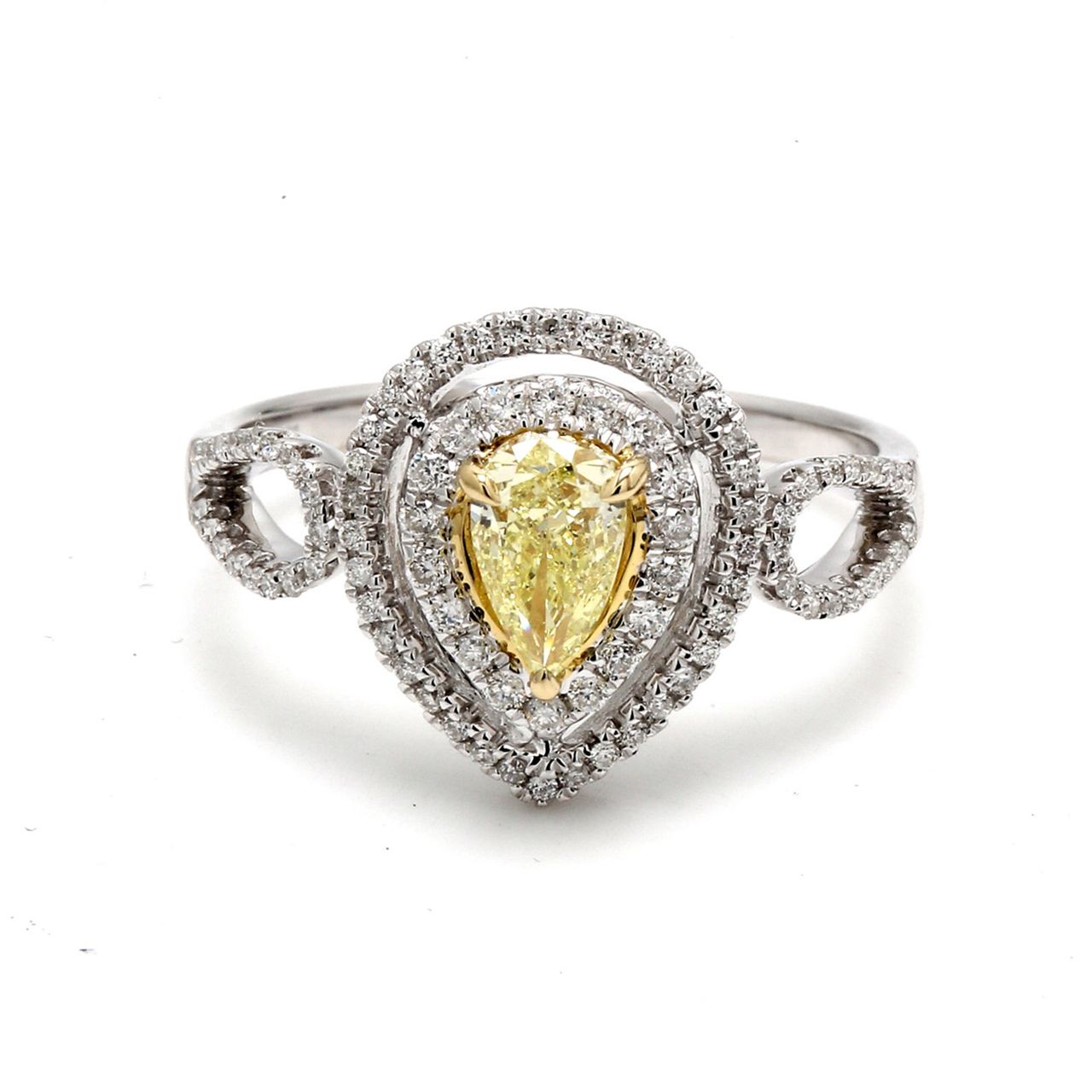 Double halo curved split-shank ring in 18K WG with French pave set rounds around a 3-prong set fancy yellow pear shape diamond center.  D0.78ct.t.w.  (Center 0.51ct.)