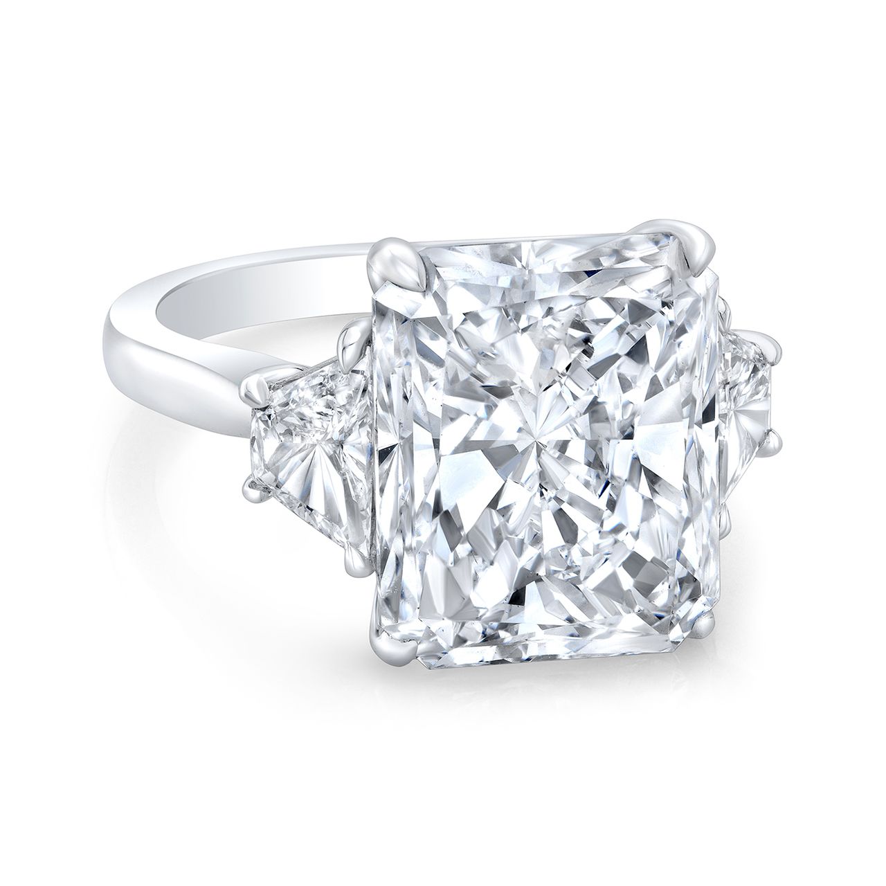 3-stone semi-mount in platinum with prong set trapezoid diamond sides.  D0.80ct.t.w.  Size 6.75