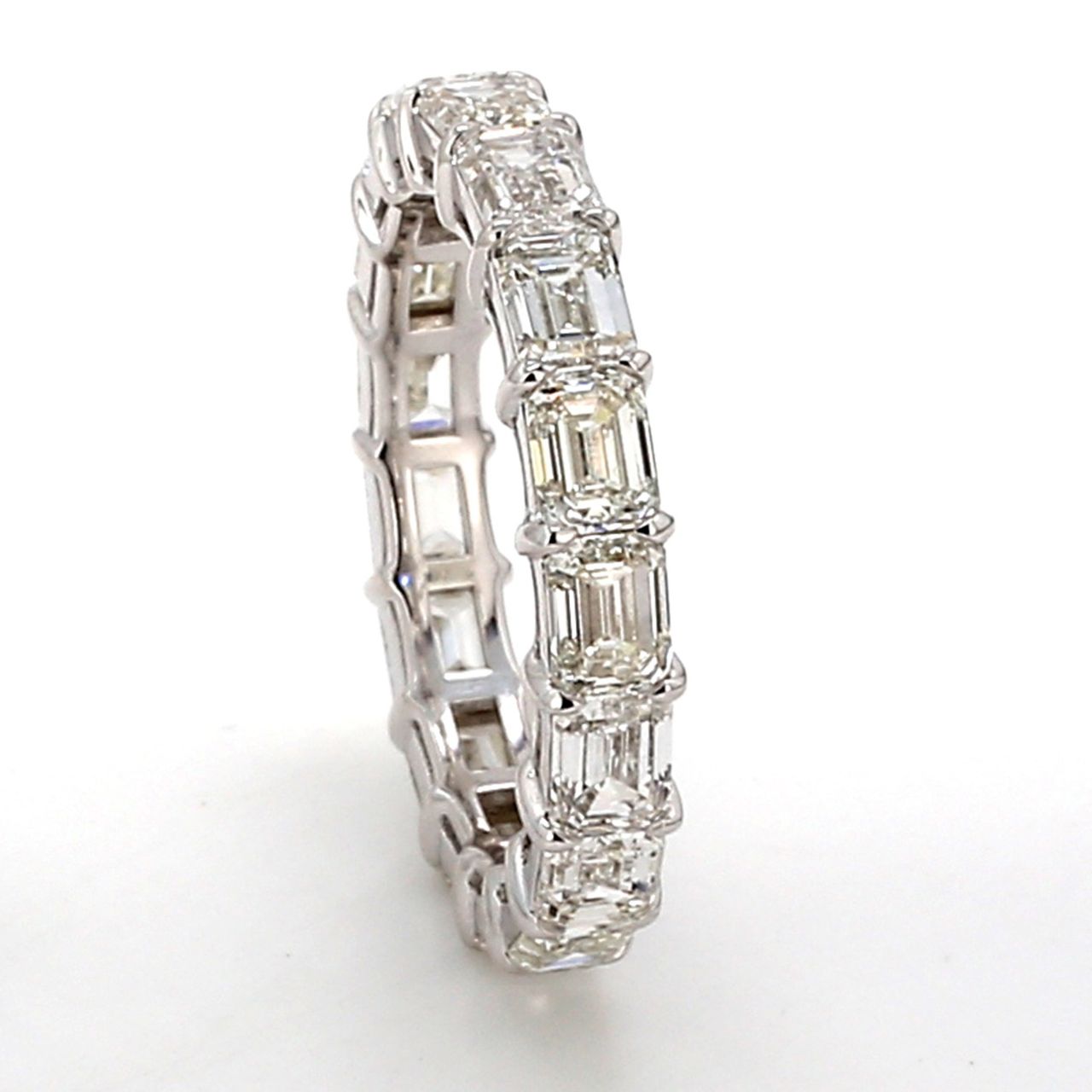 Eternity band east to west style with basket prong set (17) emerald cut diamonds.  D5.16ct.t.w.  Size 7.5