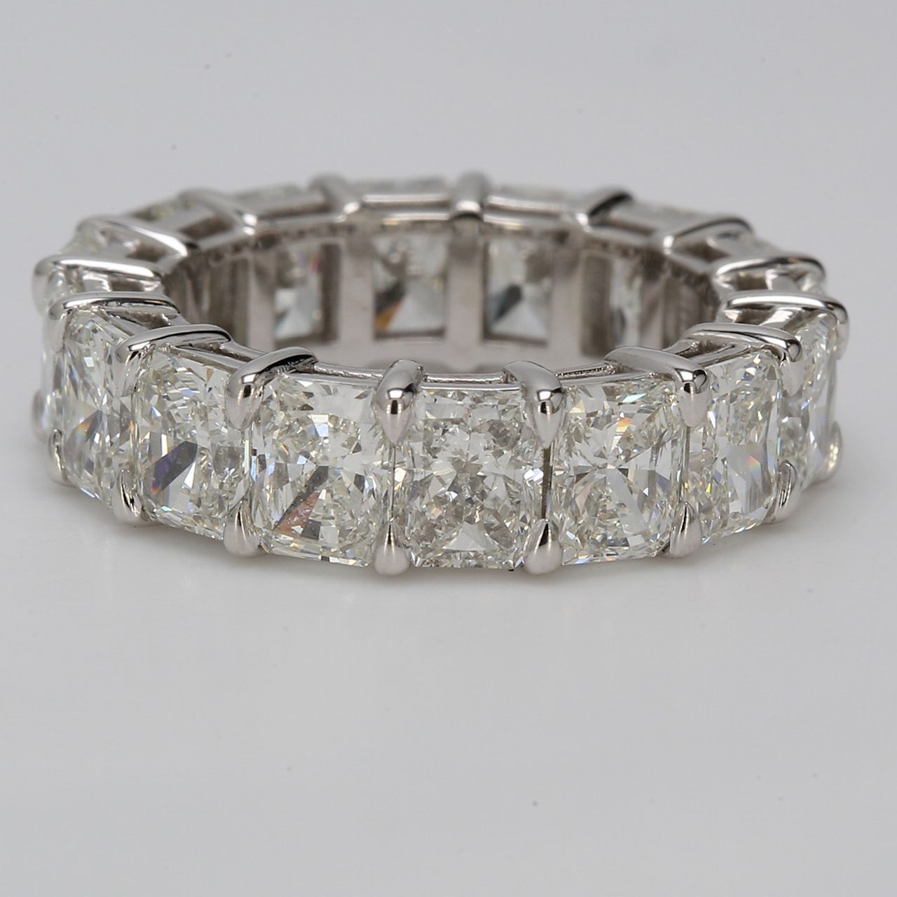 Eternity band in platinum with basket shared prong set G-H/VVS (16) radiant diamonds.  D8.75ct.t.w.  Size 5.75