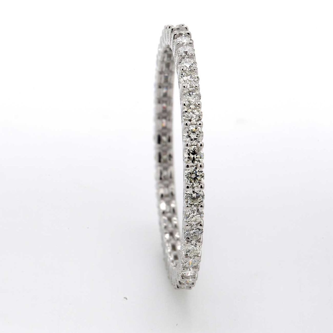 Eternity band with shared 4-prong set (39) round diamonds.  D0.60ct.t.w.  Size 6.25