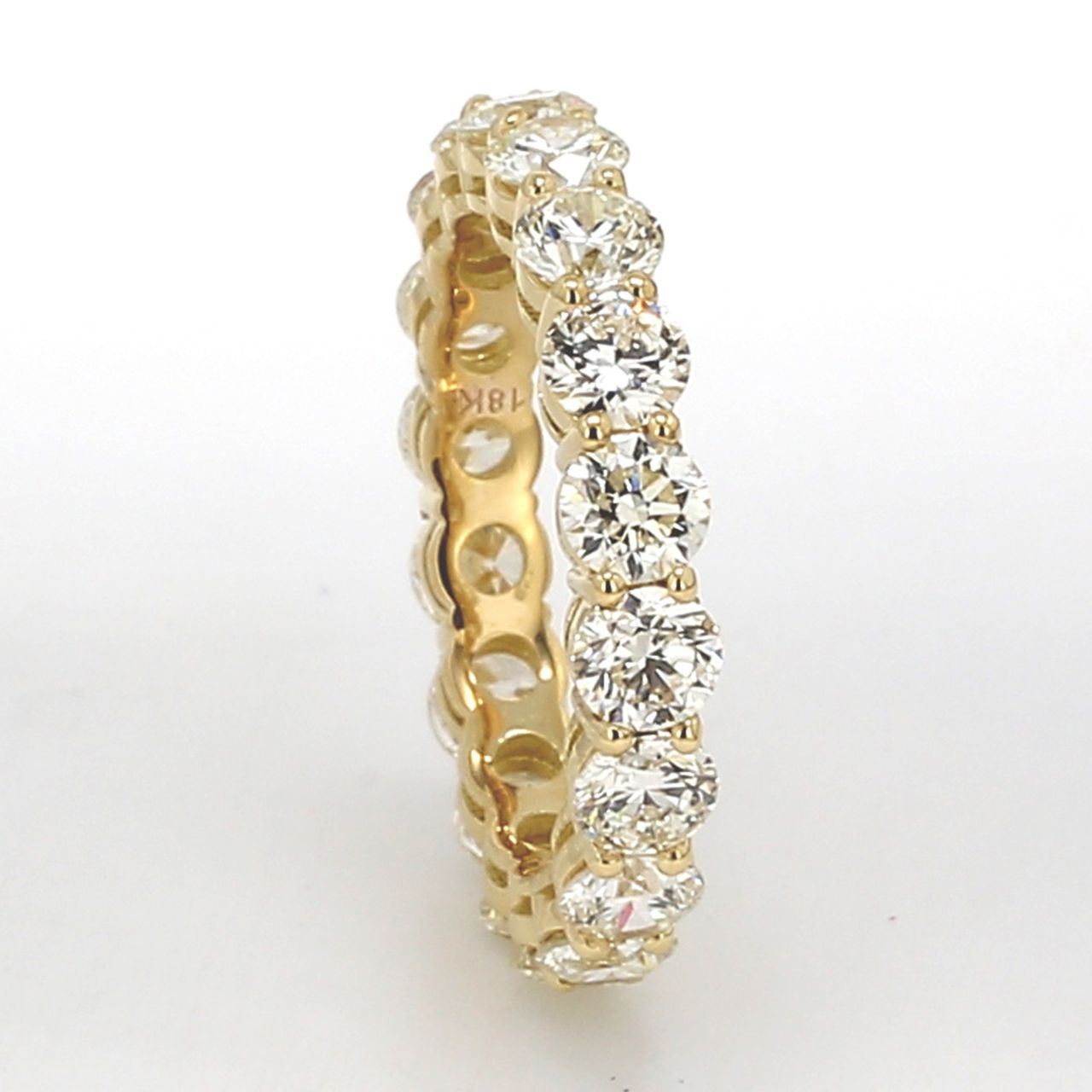 Eternity band in 18K YG with basket prong set (18) round diamonds.  D3.75ct.t.w.  Size 6.75