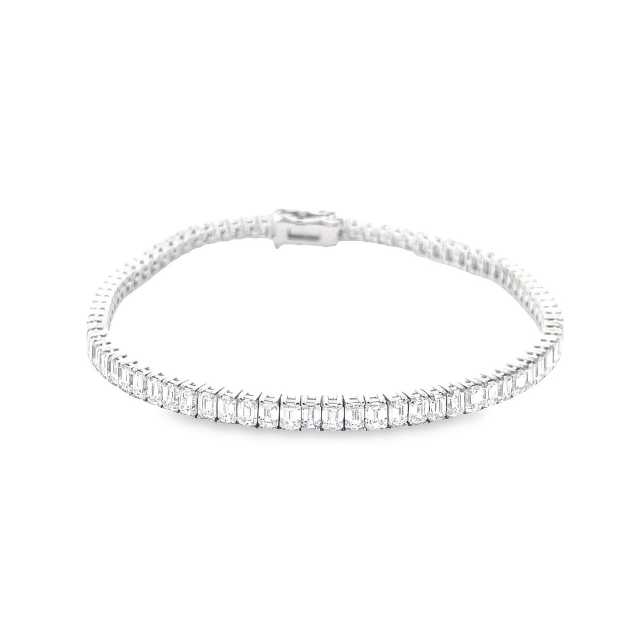 7' Tennis bracelet in 18K WG with basket prong set (80) emerald cut diamonds. D7.72ct.t.w.