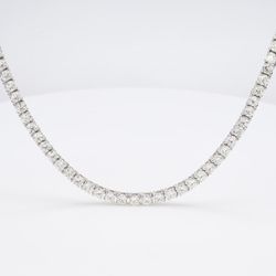 18' Tennis necklace with basket prong set (147) round diamonds.  D15.53ct.t.w.