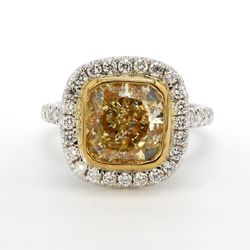 Halo semi-mount in 18K WG with prong set round diamonds.  D0.84ct.t.w.