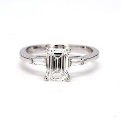 3-stone semi-mount with channel set baguette diamond sides.  D0.20ct.t.w.  Size 6.5