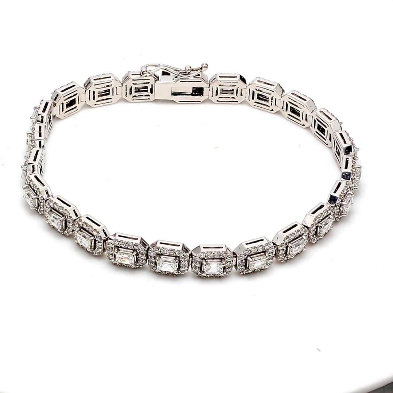 7' Halo tennis bracelet with round diamonds around (23) emerald cut diamond centers.  D6.93ct.t.w.