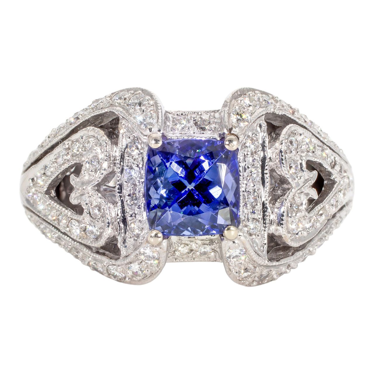 Antique style ring in 18K WG with pave set round diamonds and 4-prong set tanzanite center stone.  D0.61ct.t.w.  Tanzanite 1.65ct.