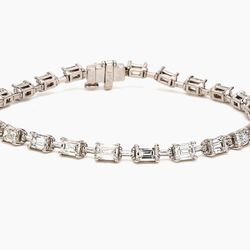 7' Tennis bracelet in platinum with basket prong set (24) emerald cut diamonds.  D6.04ct.t.w.