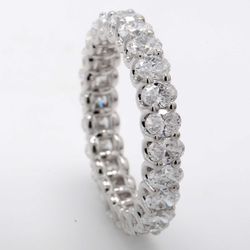 Eternity band with shared prong set (24) oval cut diamonds.  D3.20ct.t.w.  Size 7.25