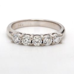 5- stone band with shared U-prong set round diamonds.  D0.71ct.t.w.  Size 6.25