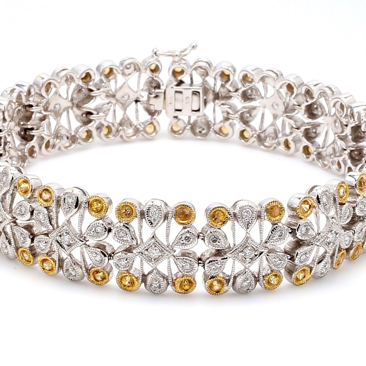 Art deco style bracelet in 18K two-tone with round diamonds & yellow sapphires.  D1.36ct.t.w.  Yellow Sapphires 0.99ct.t.w.