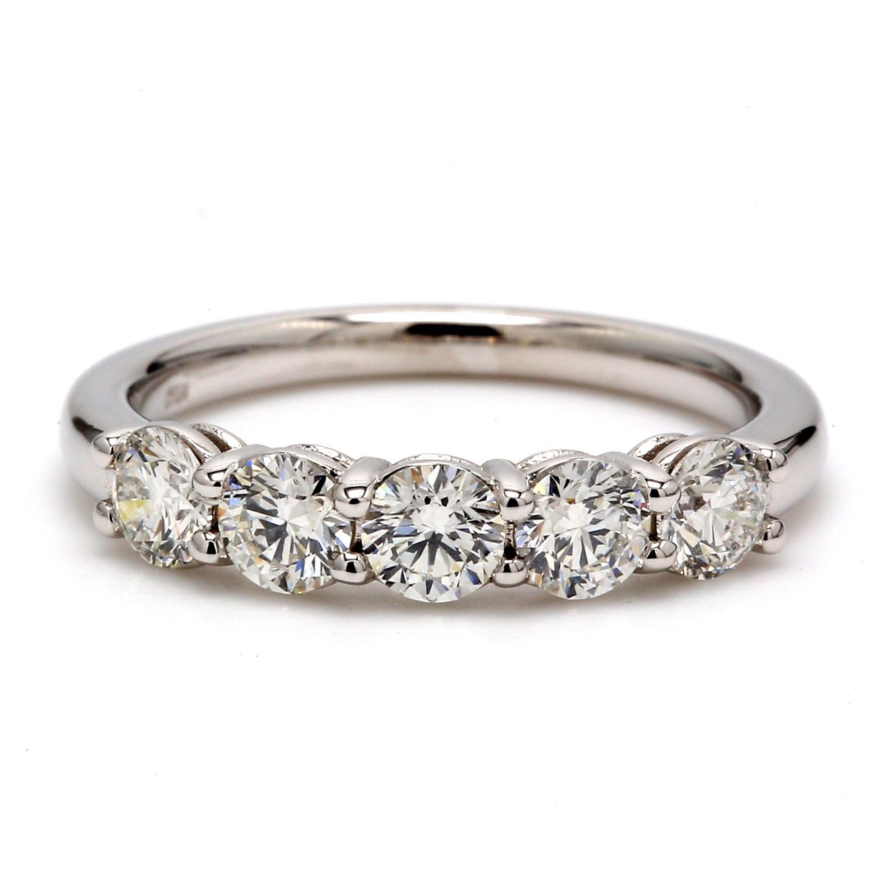 5-stone band with shared prong set round diamonds.  D1.01ct.t.w.