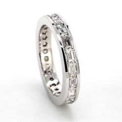 East to west style eternity band with channel set (20) emerald cut diamonds.  D2.32ct.t.w.  Size 6.25