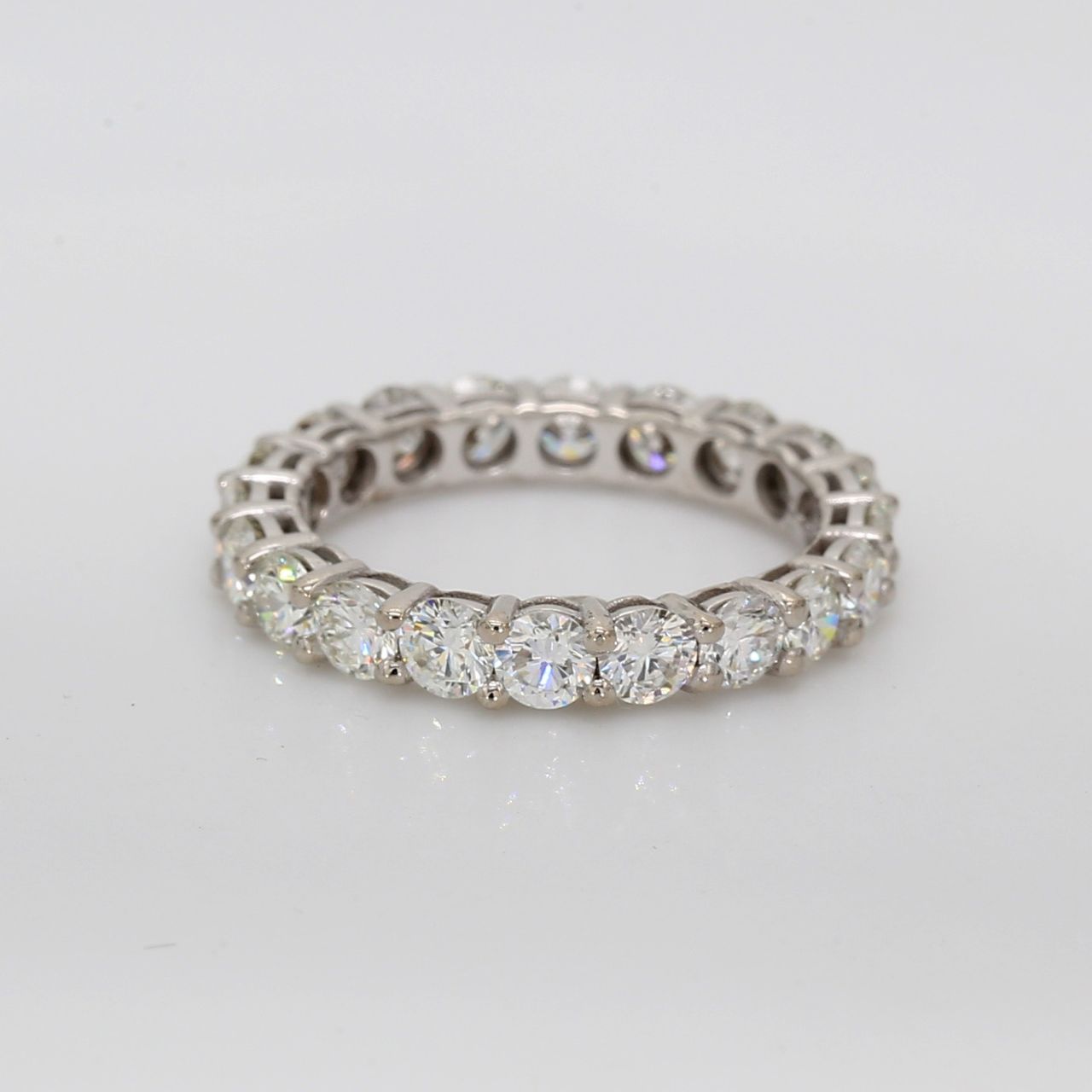 Eternity band with shared basket prong set round diamonds.  D2.07ct.t.w.  Size 4.5