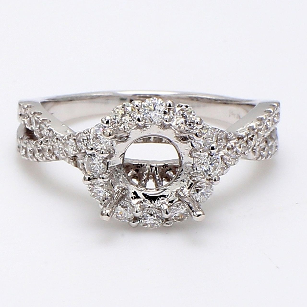 Halo split-shank semi-mount with 4-prong set round diamonds.  D0.72ct.t.w.