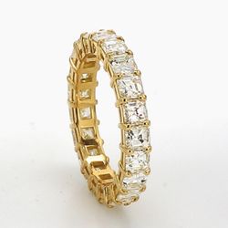 Eternity band in 18K YG with basket prong set (21) asscher cut diamonds.  D3.14ct.t.w.  Size 5.5