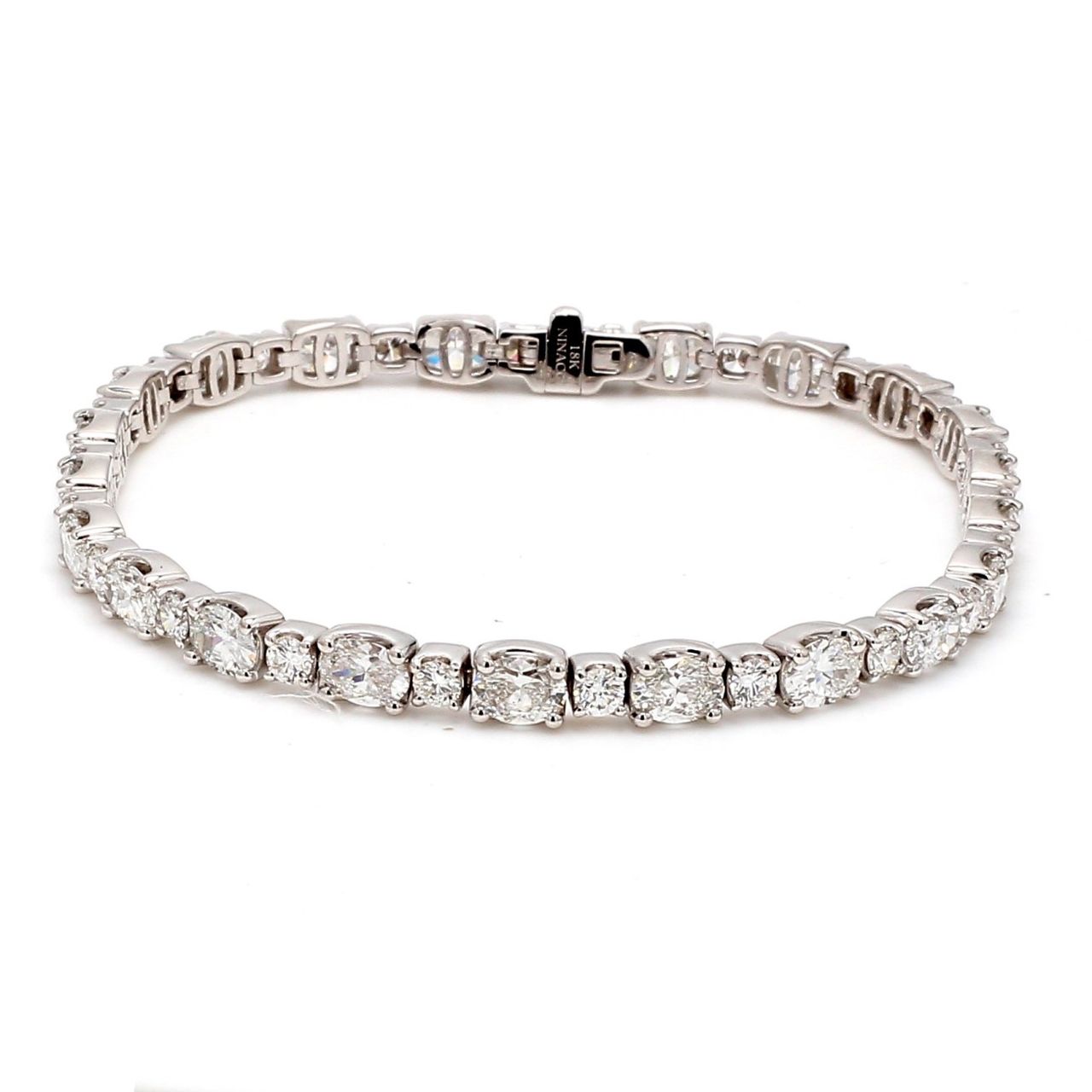 7' Tennis bracelet in 18K WG with prong set round and oval diamonds.  D10.08ct.t.w.
