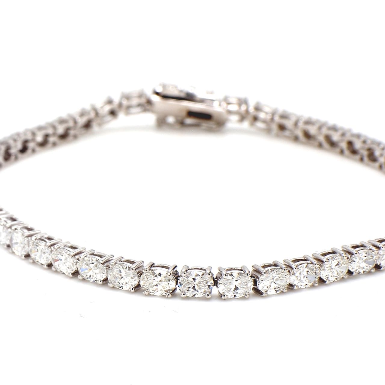 7' Tennis bracelet east to west style with 4-prong set (46) oval diamonds.  D6.42ct.t.w.