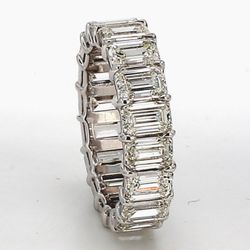 Eternity band in platinum with basket claw prong set G-H/VS+ (18) emerald cut diamonds.  D7.34ct.t.w.  Size 6.75