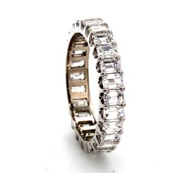 Eternity band in platinum with U-prong set (26) emerald cut diamonds.  D2.67ct.t.w.  Size 5.5