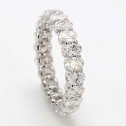 Eternity band with shared U-prong set E-F/VS+ (22) oval diamonds.  D2.97ct.t.w.  Size 6